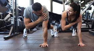 Toning Bingo Wings: Your Ultimate Guide to Sculpting Sleek Arms at the Gym 3 Fitness trainer demonstrating arm toning exercises Newport