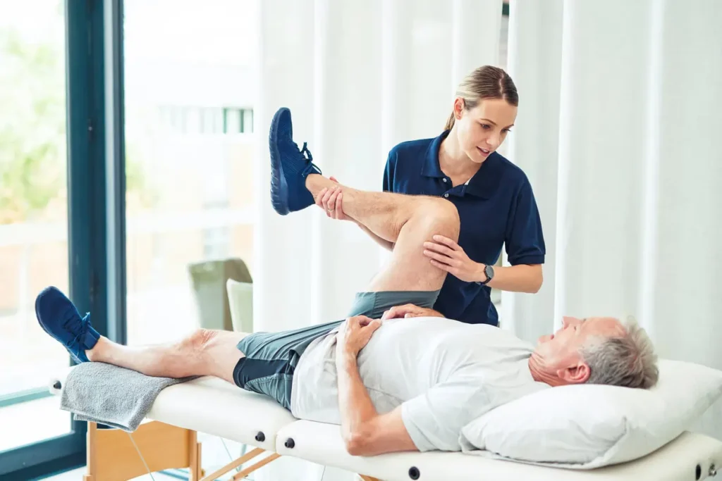 Revitalising Recovery: Effective Rehabilitation Strategies for Muscle Injuries 3 Physiotherapist assisting a patient with muscle recovery exercises Newport